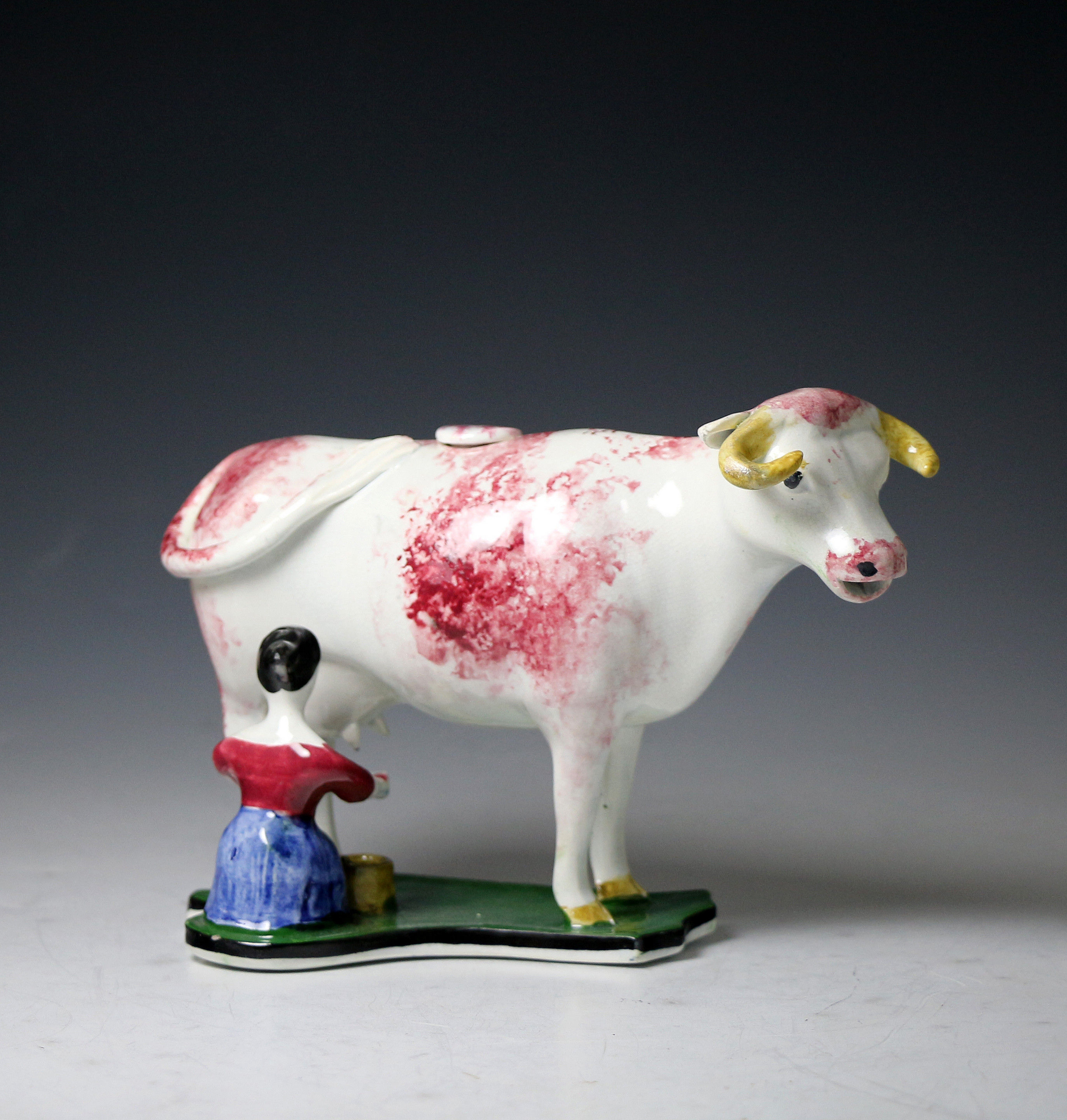 Antique pottery cow creamer with milk maid figure, Scottish Pottery early 19th century period.