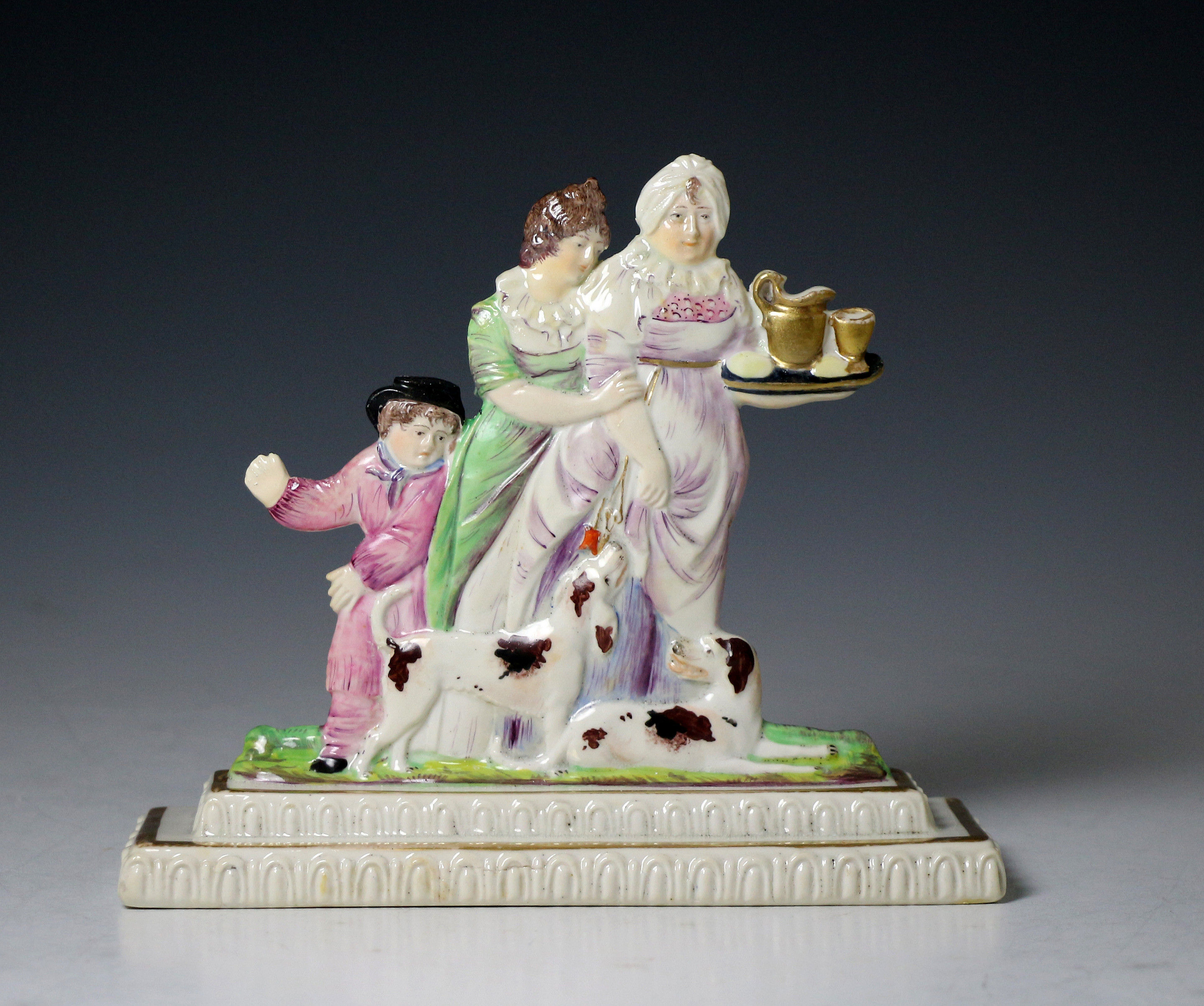 Swansea porcelain figure of  a family modelled on stepped bases. Wales c1815