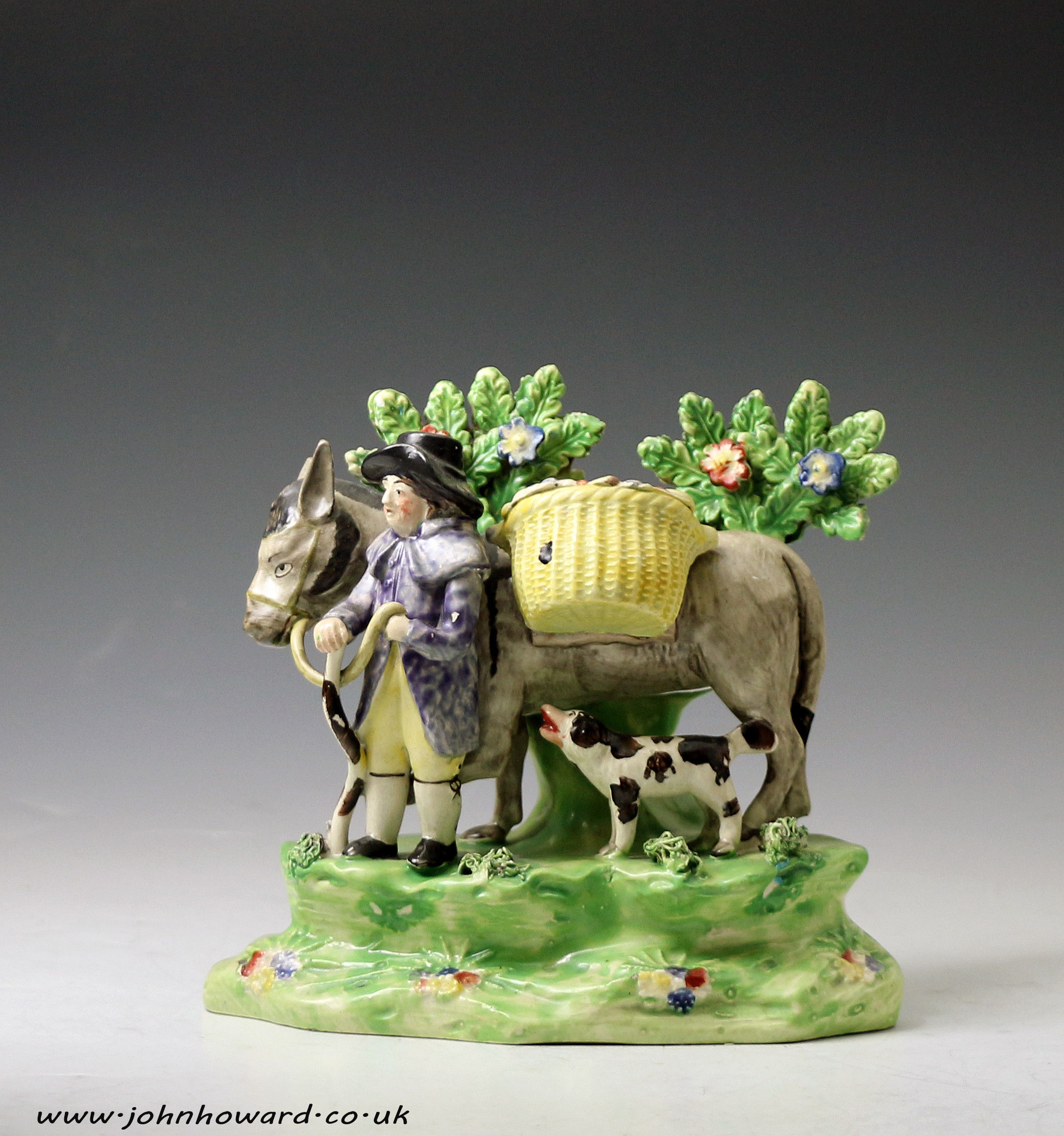 Antique Staffordhire Pottery pearlware bocage figure of the JOLLY TRAVELLER early 19th century England.