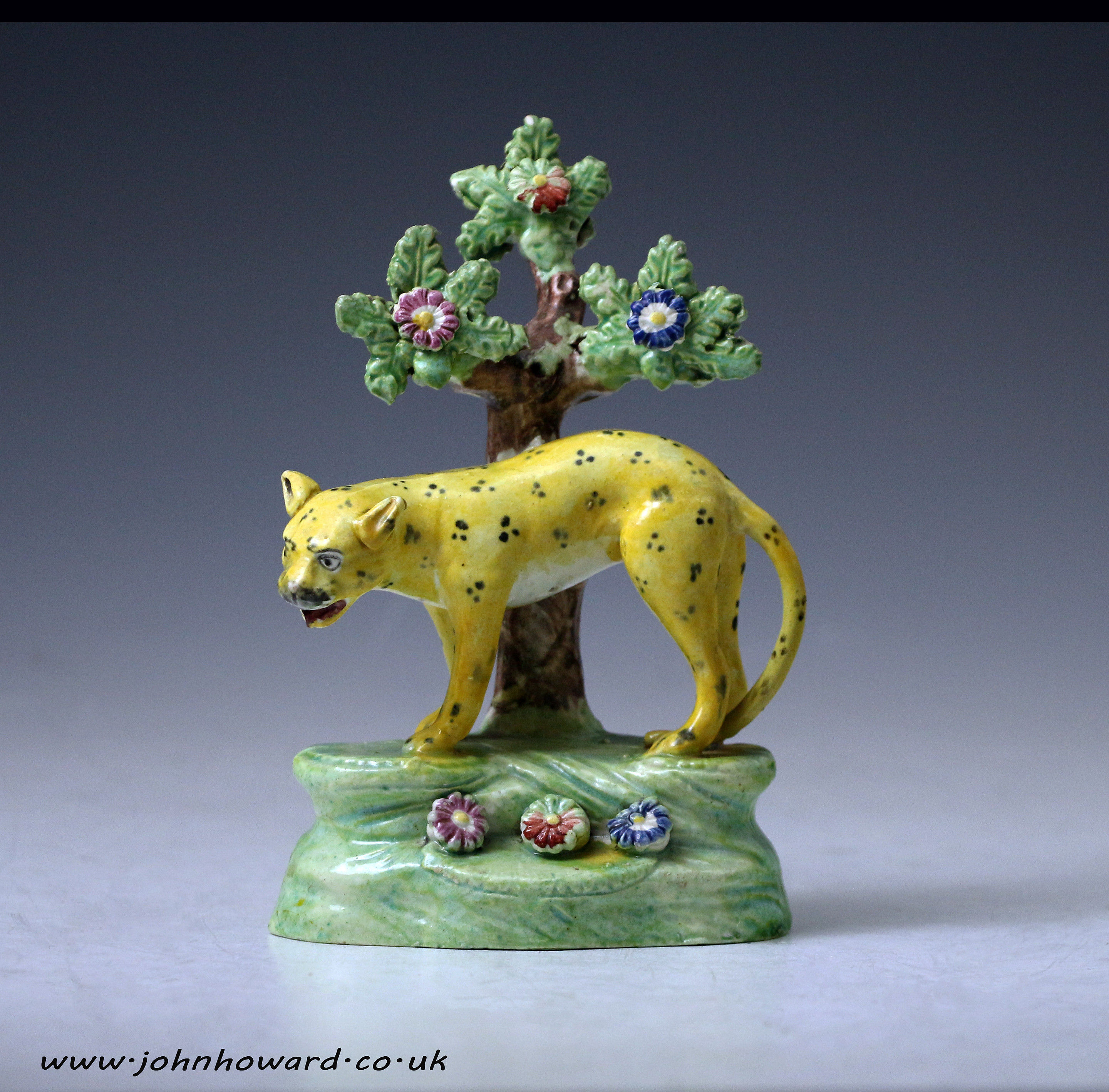 Staffordshire pottery pearlware bocage figure of a leopard , early 19thc England.
