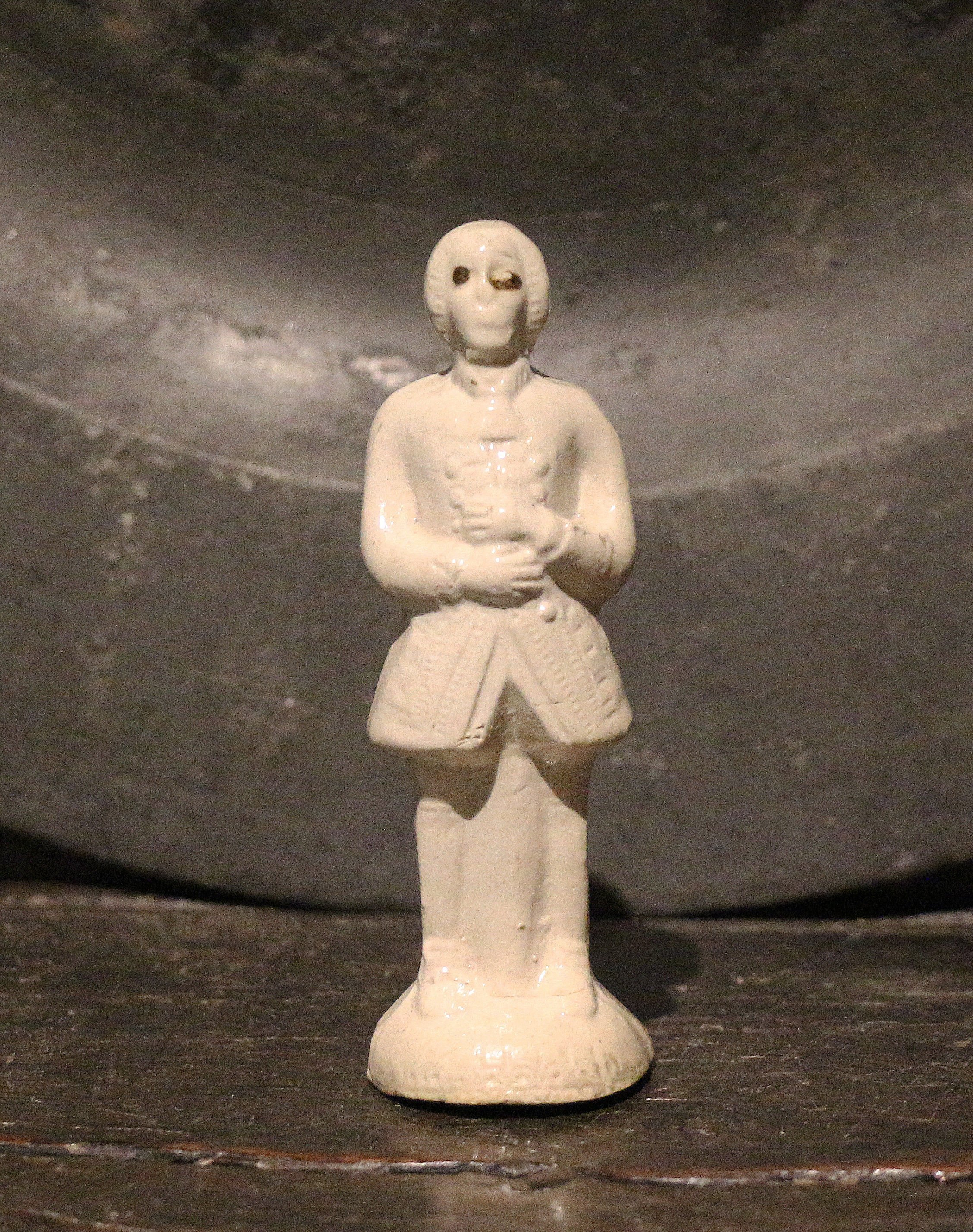 Early Staffordshire pottery figure in saltglaze of a fashionably dressed gentleman. c1745