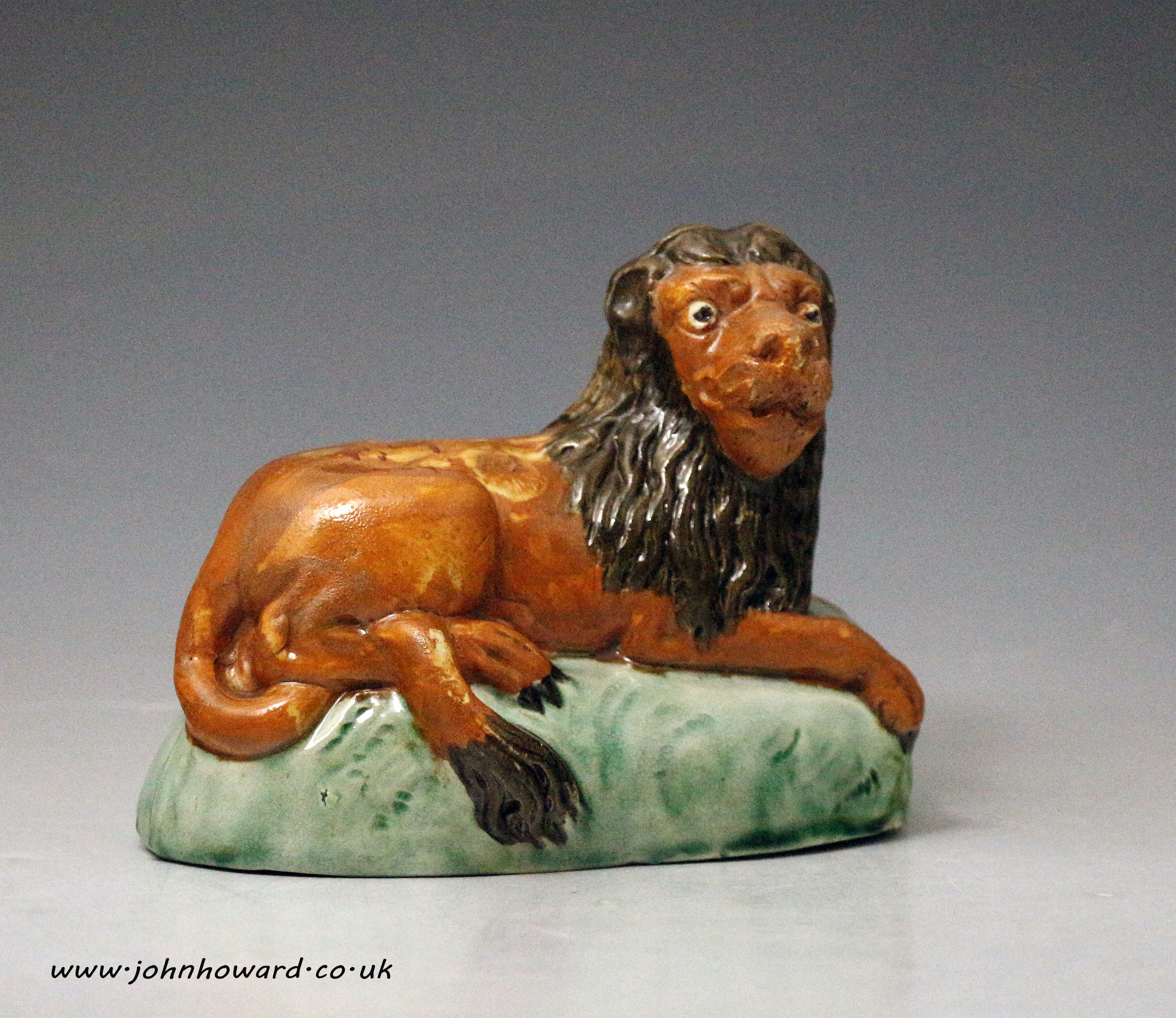 Antique English pottery figure of a lion in Prattware late 18th century period