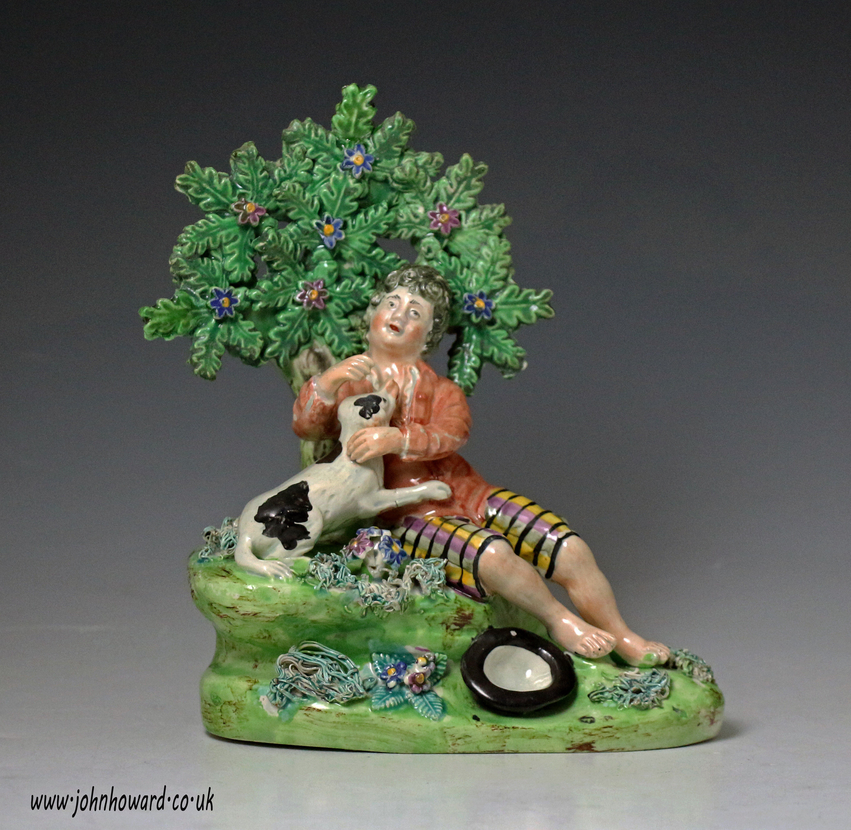 Antique Staffordshire pottery pearlware figure of shepherd boy with dog early 19th century